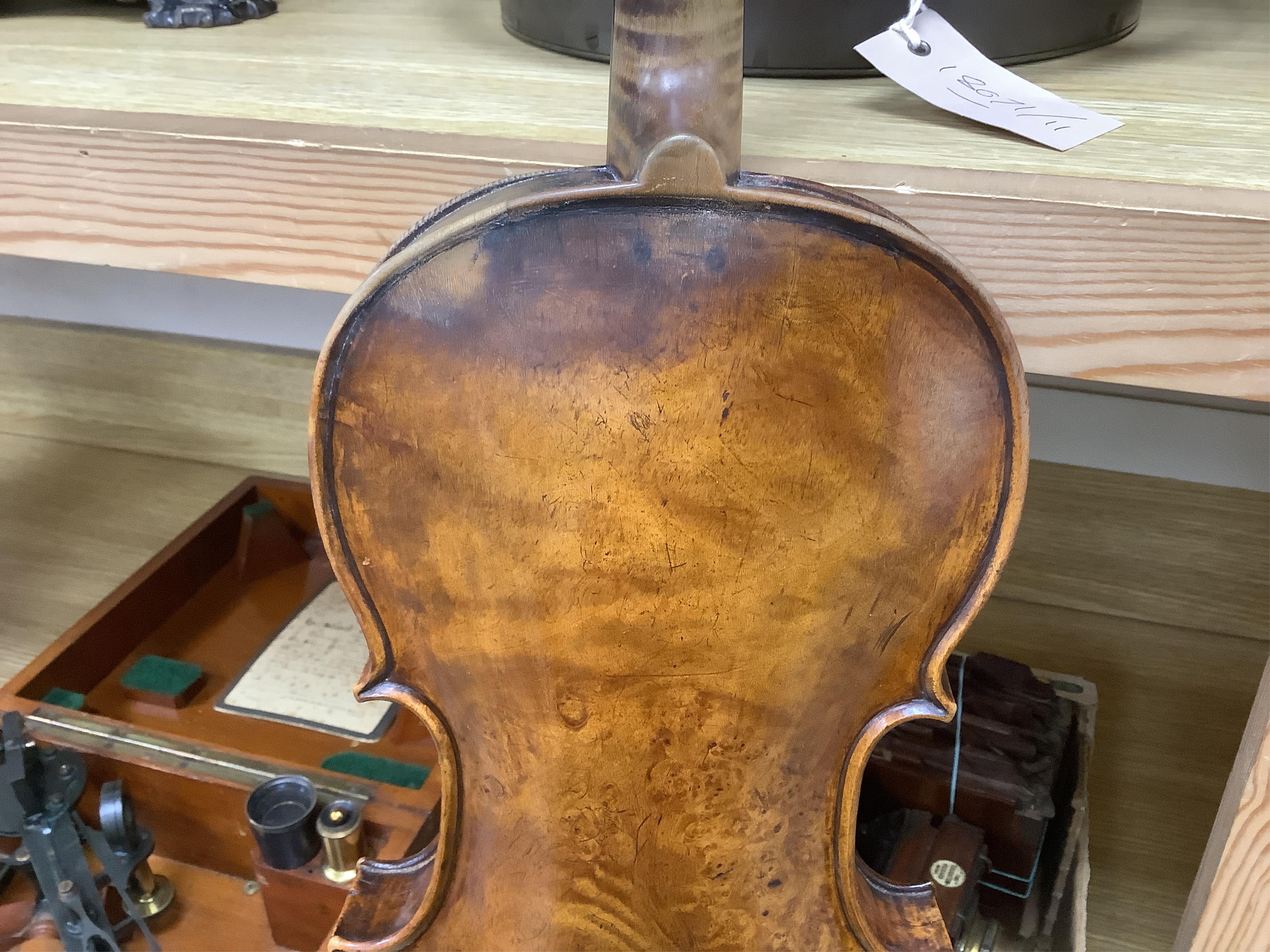 An interesting late 18th century violin, with one piece bird’s eye maple back, unsigned, with two silver fully mounted octagonal bows, one stamped Voight CITES Submission reference, 3XFNUBT7 and Submission reference, RHL